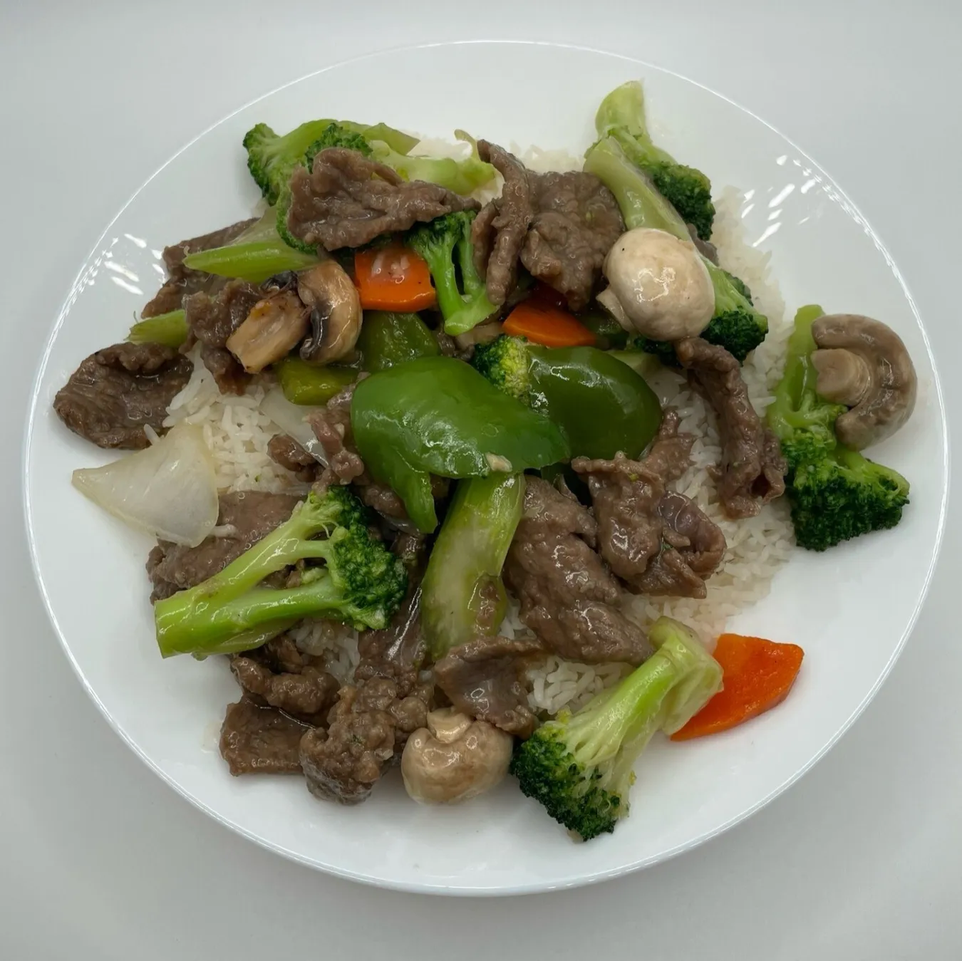 Stir Fry Mixed Vegetables with Beef over Steamed Rice